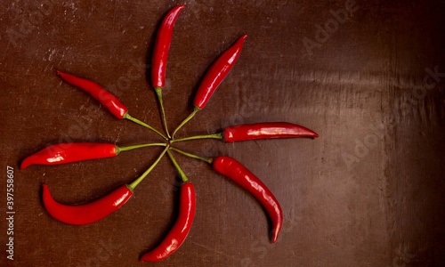 Red hot chili peppers on wooden background photo