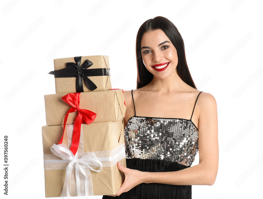 Woman in party dress holding Christmas gifts on white background Woman in party dress holding Christmas gifts on white background