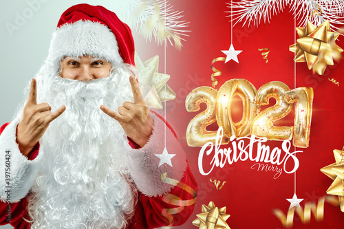 Portrait of a cheerful Santa Claus in a red suit on a light background with the gold numbers 2021.mixed media. Concept for Christmas Eve, Vacation, Holiday Banner, New Year