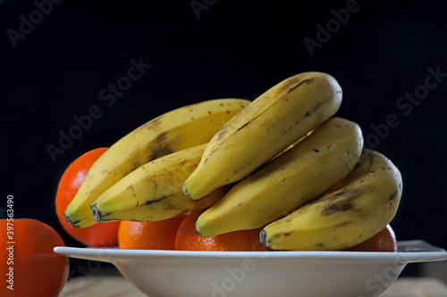 Various fresh fruits; tangerine, banana. photo