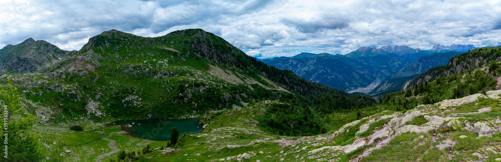Italy, Trentino, Predazzo, Lagorai, Lago delle Trote - 19 July 2020 - Panoramic view of Latemar and a glimpse of the Lagorai