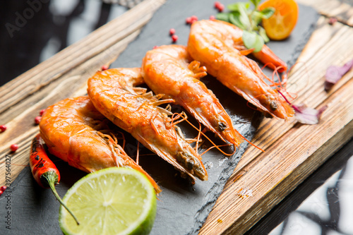 Boiled king prawns with lemon and lime. Beer snack.