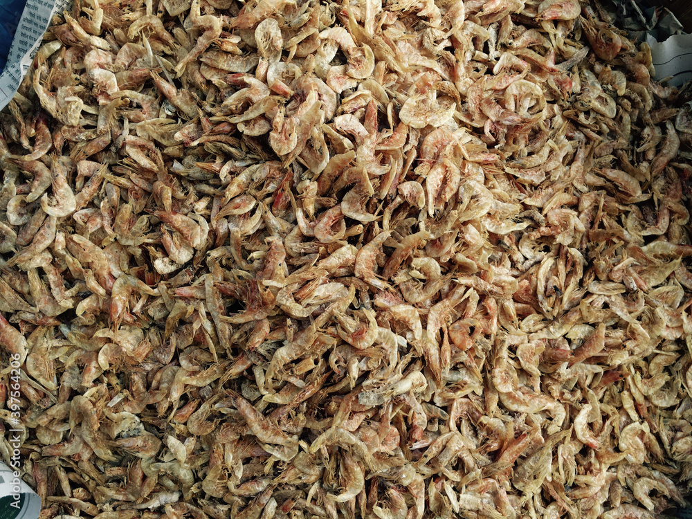 Heap of dried prawns or shrimps selling in the market. Preserved prawns is vey popular and flavorful ingredient used in many far-easten and asian countries. Heap of dried prawns or shrimps selling in the market. Preserved prawns is vey popular and flavorful ingredient used in many far-easten and asian countries.
