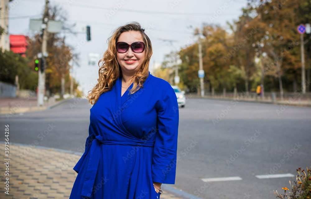 Beautiful woman on a walk in the city. Autumn- Winter time. A nice middle aged plus size woman at the street. Citizen lifestyle Beautiful woman on a walk in the city. Autumn- Winter time. A nice middle aged plus size woman at the street. Citizen lifestyle