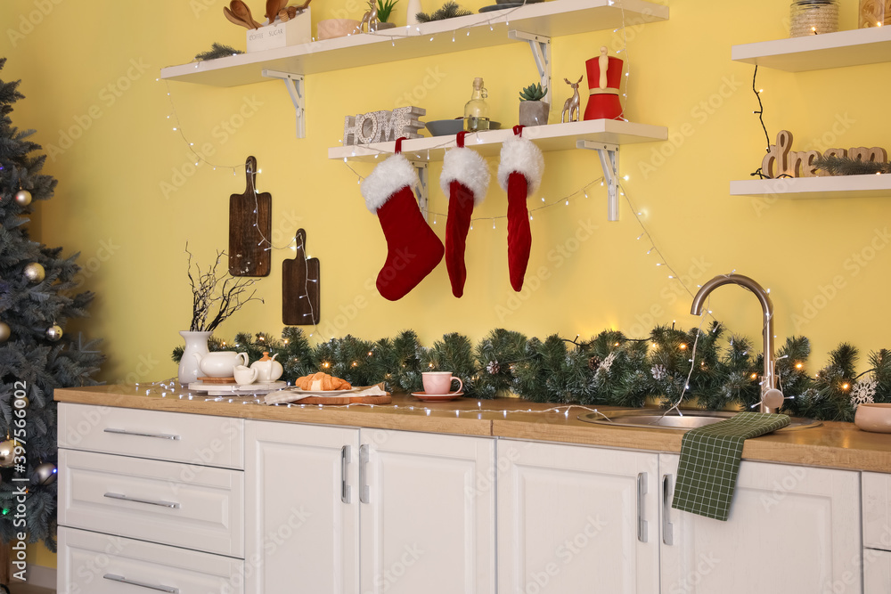 Interior of modern kitchen decorated for Christmas Interior of modern kitchen decorated for Christmas