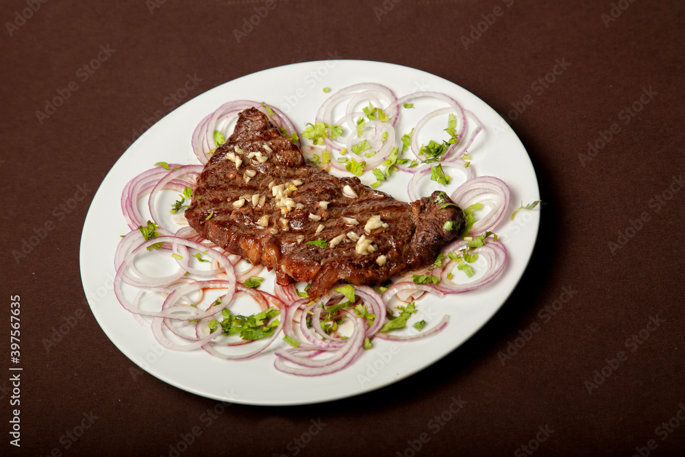 Veal steak with garlic and onions in Georgian Veal steak with garlic and onions in Georgian