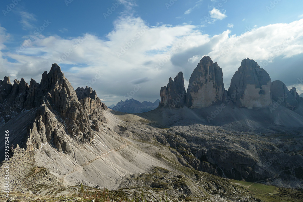 A panoramic capture of the famous Tre Cime di Lavaredo (Drei Zinnen) and surrounding mountains in Italian Dolomites. The mountains are surrounded by thick clouds. A lot of landslides. Serenity A panoramic capture of the famous Tre Cime di Lavaredo (Drei Zinnen) and surrounding mountains in Italian Dolomites. The mountains are surrounded by thick clouds. A lot of landslides. Serenity