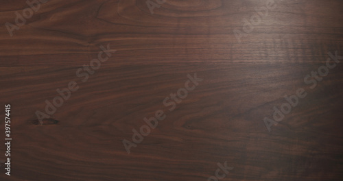 background texture of dark toned black walnut surface