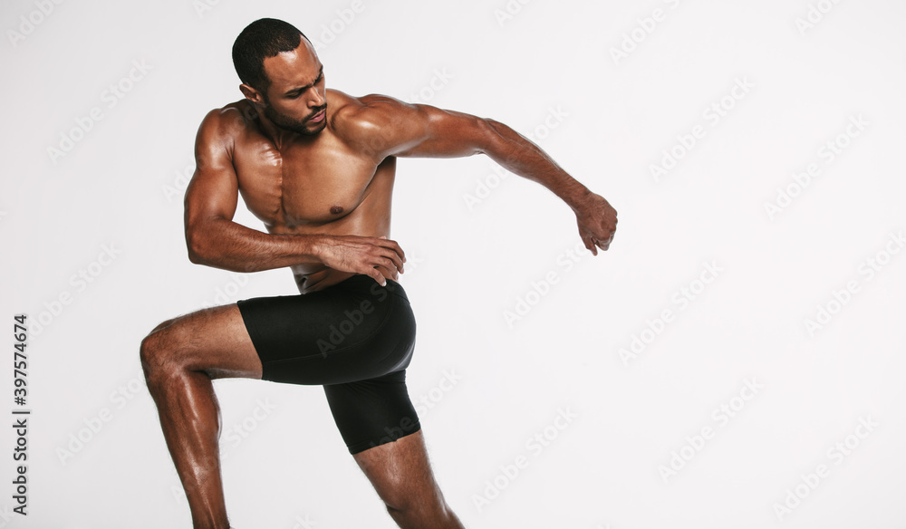 Muscular athlete doing fitness training Muscular athlete doing fitness training