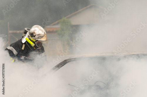 Firefighter intervening in a car fire