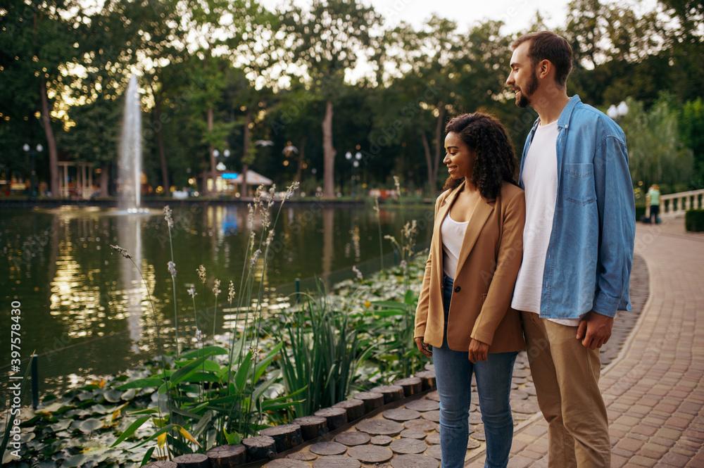 Fototapeta premium Romantic love couple walking at the pond in park