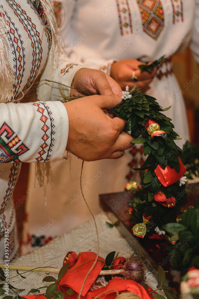 Fototapeta premium Wedding traditions in Ukraine, periwinkle wreath for the bride on her wedding day from her parents.