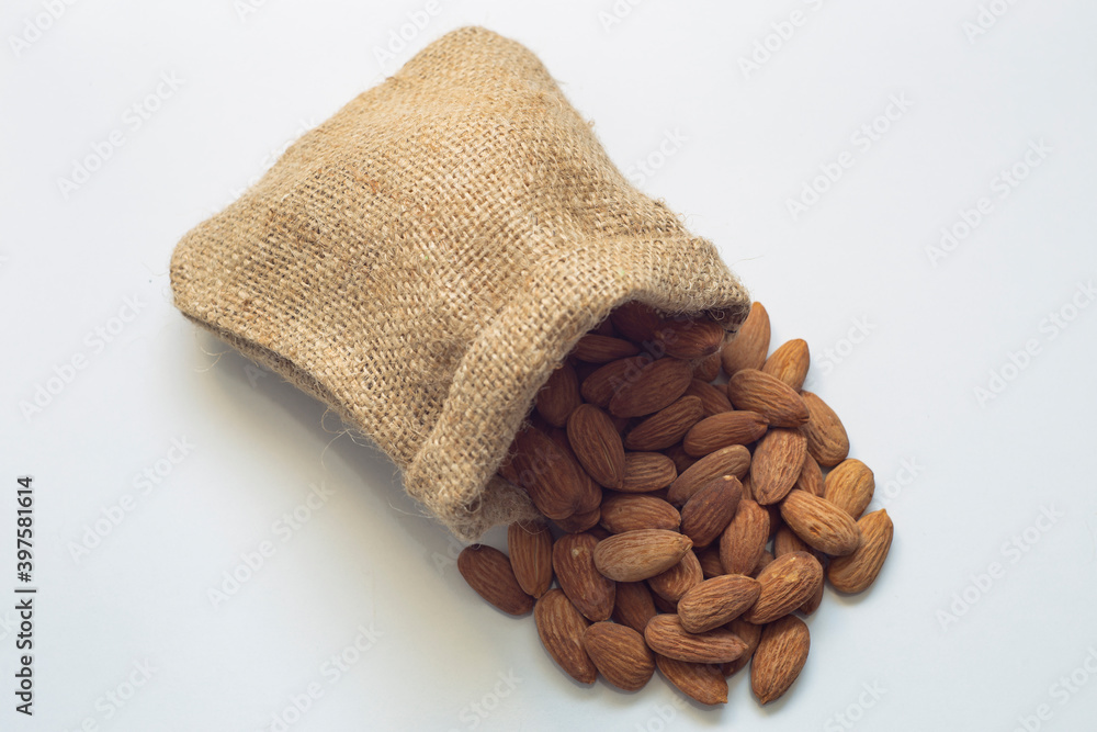 Roasted almonds on an insulated table. varieties of almonds grown in Turkey is more. There are various types of almonds such as roasted, candied, chocolate.