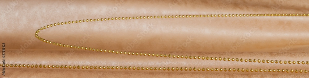 Gold beads on a background of curtains