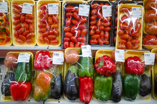 Sets of vegetables packed in plastic package in supermarket. Tomato, red and green pepper. Mendoza, Argentina