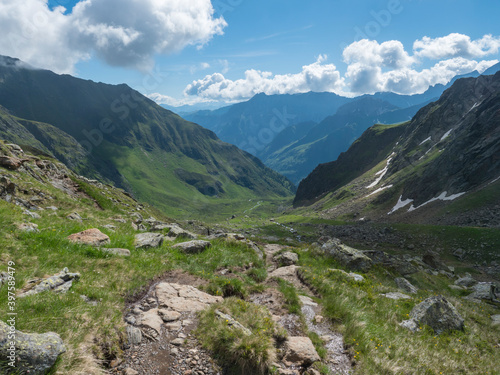 Beutiful green summer alpine mountain valley with winding river spring stream. Stubai hiking trail, Stubai Hohenweg at Tyrol, Austrian Alps