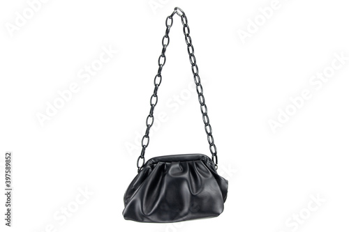 women handbag hanging against white background. Beautiful luxurious bright black leather handbag front view, without shadow on white background Handbag isolated hangs on black chains © Holger