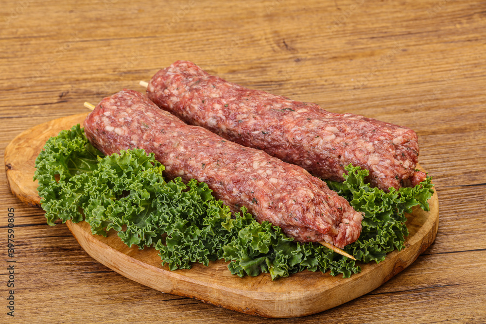 Raw minced beef kebab skewer