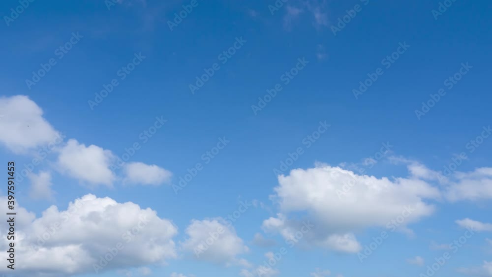 Cumulus cloud cloudscape in Blue sky and white clouds timelapse in bright sunny day. Puffy fluffy white clouds. Summer clear sky time lapse. Nature weather atmosphere background. oxygen ozone space Cumulus cloud cloudscape in Blue sky and white clouds timelapse in bright sunny day. Puffy fluffy white clouds. Summer clear sky time lapse. Nature weather atmosphere background. oxygen ozone space