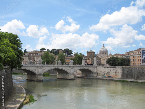 Rome, Italy - Ponte Sant'Angelo, a bridge across the Tiber River in Rome, on a spring day with fluffy white clouds. Image has copy space.