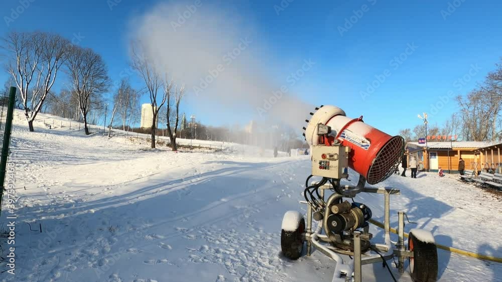 The work of the snow cannon. Sunny winter day in the mountains The work of the snow cannon. Sunny winter day in the mountains