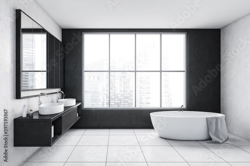 Grey and white bathroom with white bathtub  mirror and big window