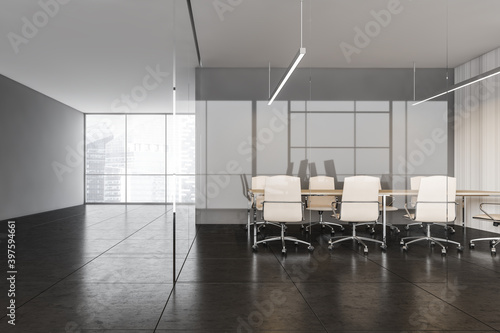 Black and white conference room with leather armchairs with window