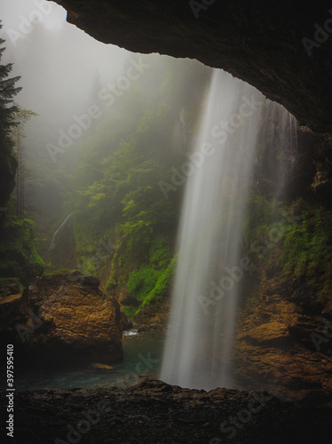 B  rglist  ber Berglist  ber Waterfall behind a waterfall green moody