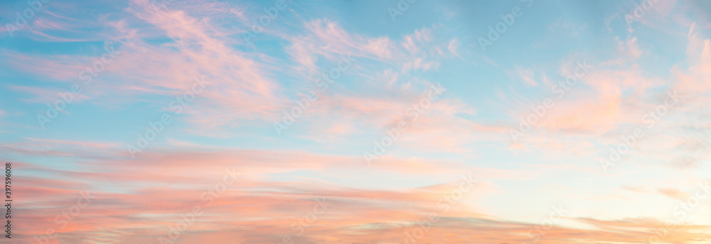 light soft panorama sunset background, blue sky and pink clouds