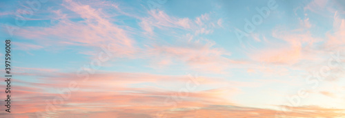 light soft panorama sunset background, blue sky and pink clouds