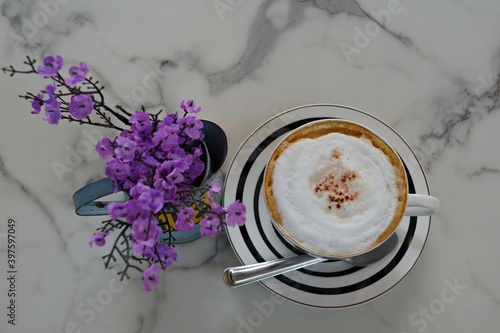 Creamy coffee on a marble-patterned table