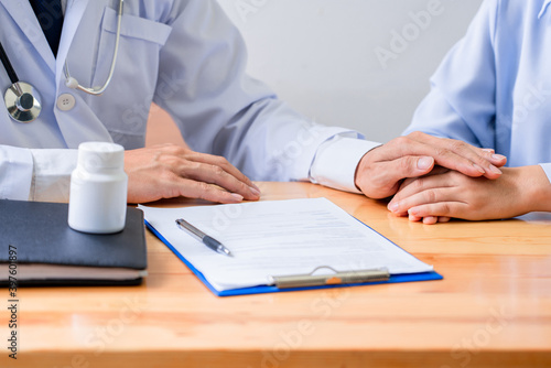 Asian Doctor giving medical consultation diagnostic to patient  Medical physician working in hospital  Healthcare concept.