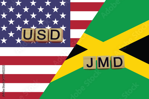 USA and Jamaica currencies codes on national flags background