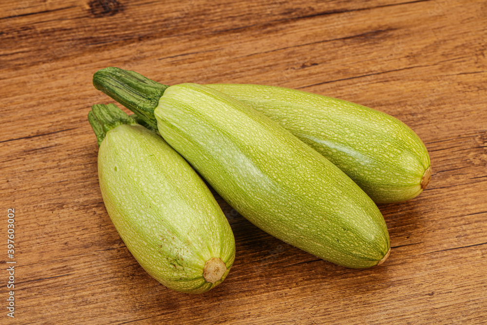 Young tasty zucchini over board Young tasty zucchini over board
