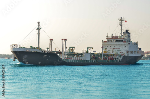 Fuel tanker was sailing in the estuary of the sea in the morning.