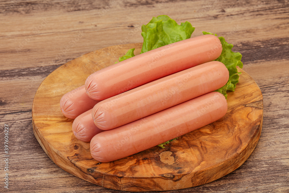 Tasty meat sausages over board Tasty meat sausages over board