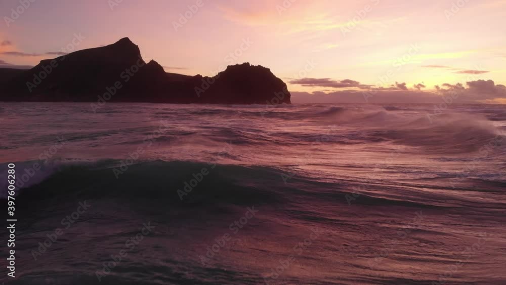 Vibrant Calheta sunset view from a low flying drone pulling back towards the shore. Vibrant Calheta sunset view from a low flying drone pulling back towards the shore.
