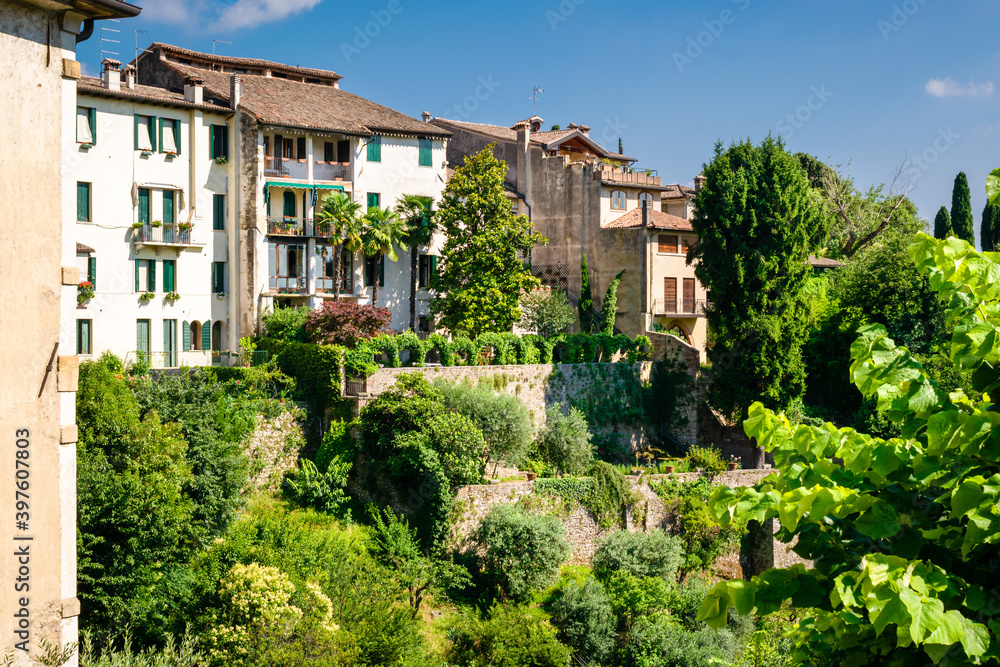 Detail of the ancient village of Asolo that climbs the hill dense with lush vegetation in summer, Treviso, Italy