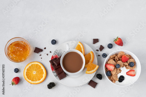 Fruit layout with yogurt and coffee on a white background