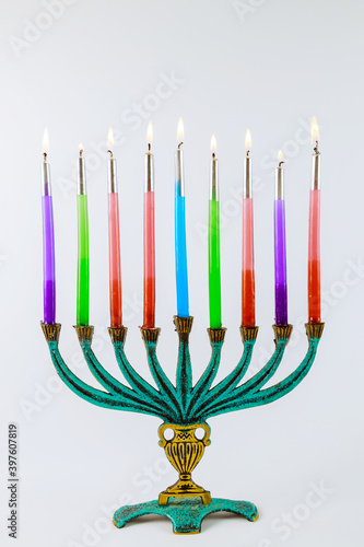 Jewish holiday Hanukkah with hanukkiah menorah on nine candles