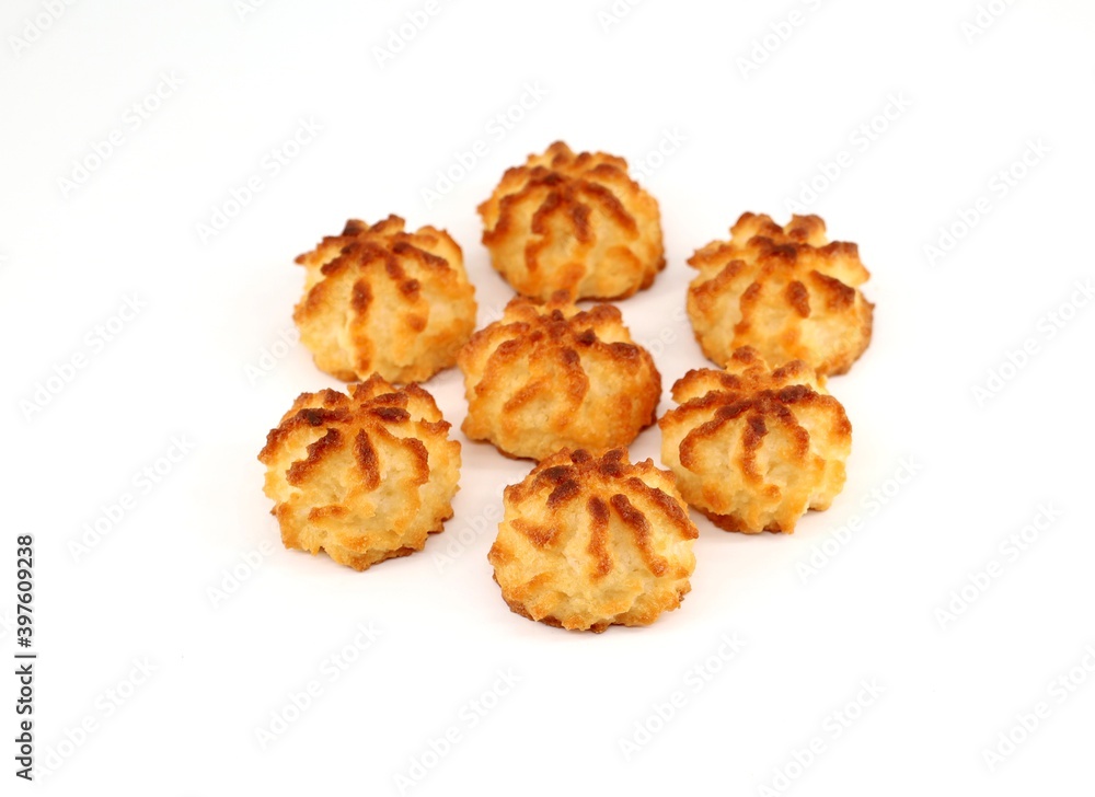 Rocher au coco, coconut rocks in english, on white background. They are small cake with grated coconut of belgian and french tradition. They are known also as Congolais.