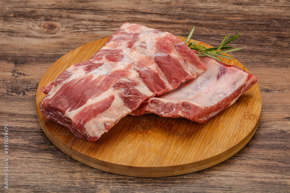 Raw pork ribs served rosemary Raw pork ribs served rosemary