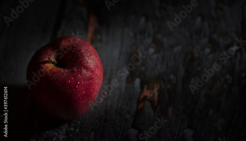 red apple on dark wooden background