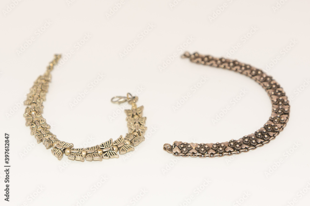 Selective focus Macro photo of a hand bracelet with white background
Selective focus Macro photo of a hand bracelet with white background