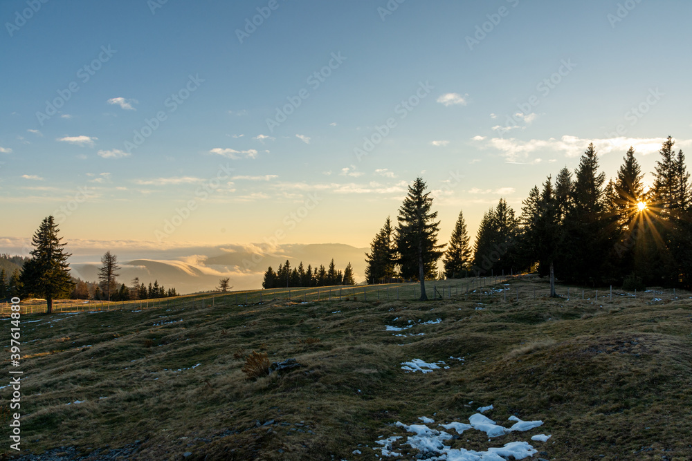 Obraz premium Sunset at Sommeralm and clouds in the background