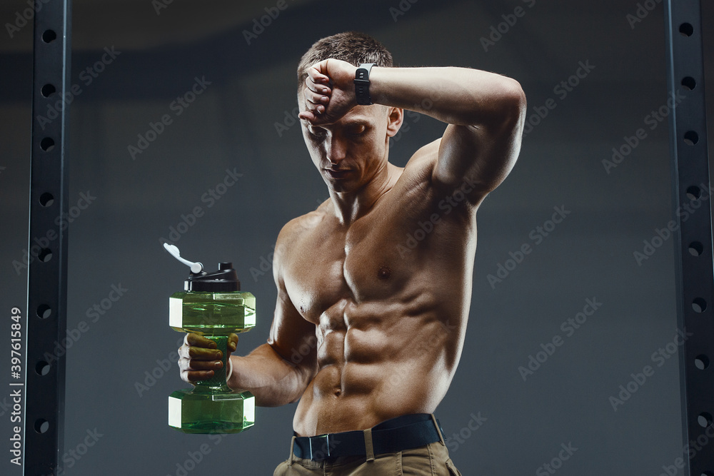 man drinking water after fitness workout