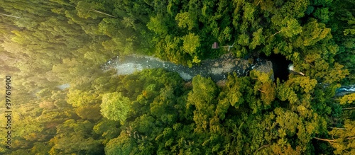 panoramic view of a waterfall in the middle of a tropical rain forest with aerial photos of North Bengkulu, Indonesia