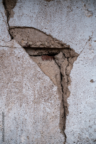 cracked walls with splices in old concrete building photo