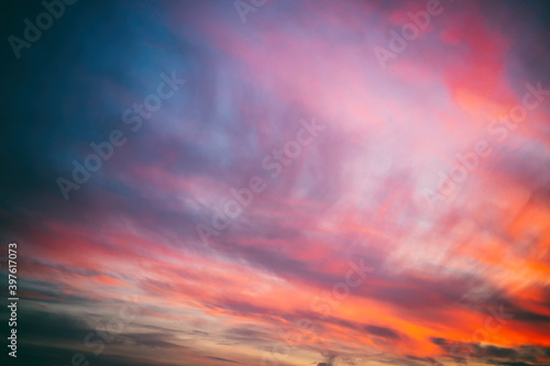 Bright amazing amazing sunset sky with blurry clouds, abstract nature background and texture