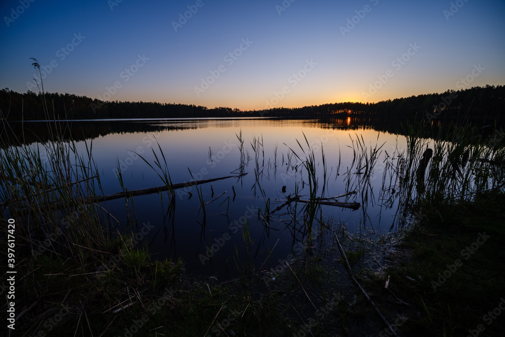 dramatatic red dark sunset over the fields and cities